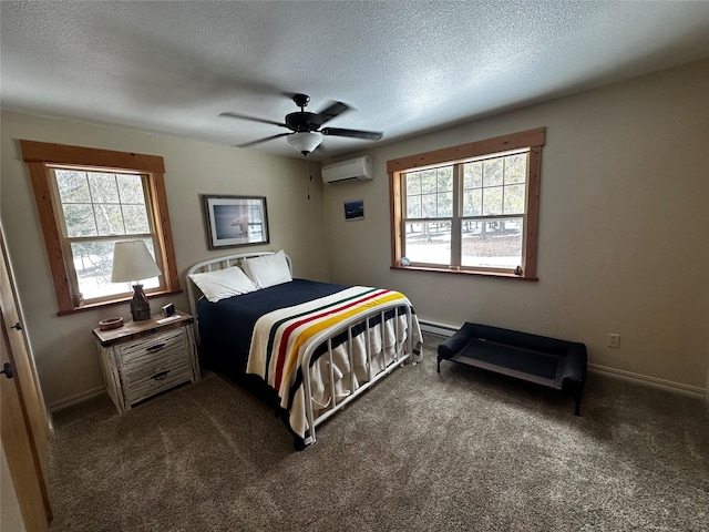 bedroom featuring a baseboard heating unit, dark colored carpet, a wall mounted air conditioner, and multiple windows