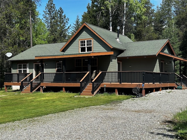 22 Pinewoods Dr, Trout Creek, MT 59874 - view of front of house with a shingled roof and a front yard