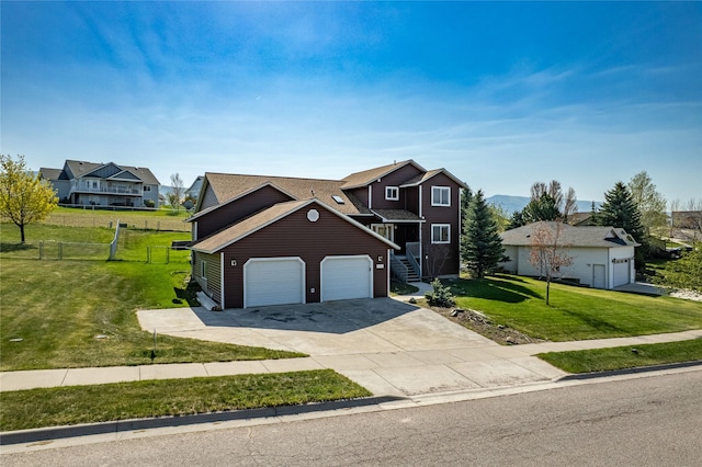 6864 Joy Dr, Missoula, MT 59803 - traditional-style house with concrete driveway, an attached garage, and a residential view