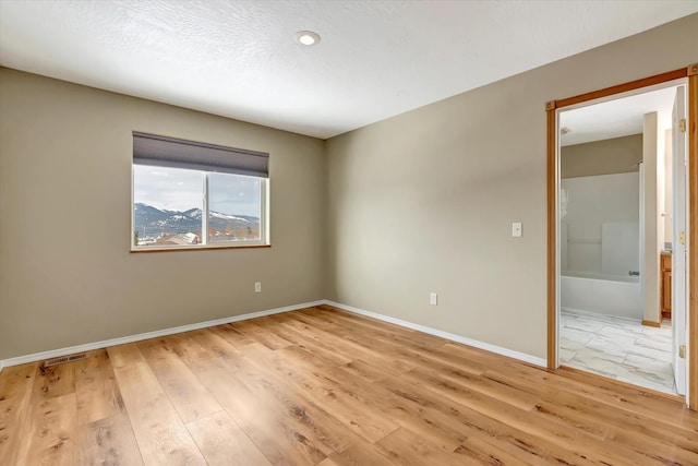 6864 Joy Dr, Missoula, MT 59803 - empty room with baseboards, light wood-style floors, and recessed lighting