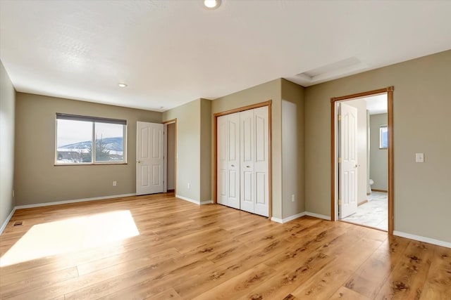 6864 Joy Dr, Missoula, MT 59803 - unfurnished bedroom with light wood finished floors, baseboards, a closet, and recessed lighting