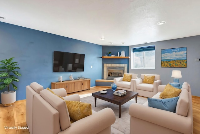 6864 Joy Dr, Missoula, MT 59803 - living area featuring light wood-type flooring, a tile fireplace, recessed lighting, and baseboards