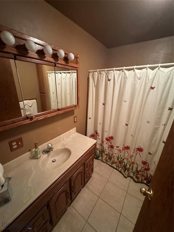 bathroom featuring tile patterned flooring and vanity