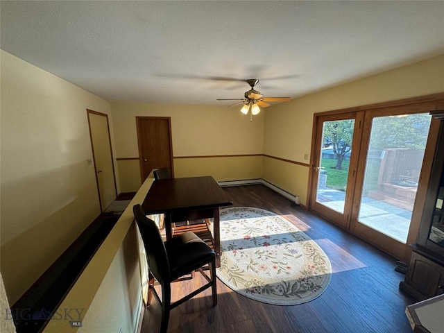 dining area with ceiling fan, a baseboard heating unit, a baseboard radiator, and wood finished floors