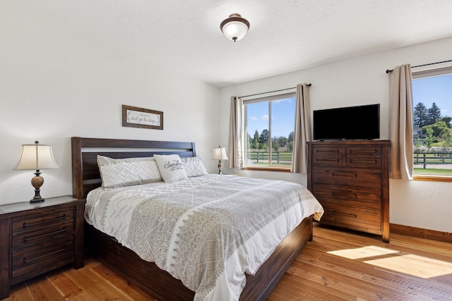 4416 Gem Ranch Rd, Stevensville, MT 59870 - bedroom featuring hardwood / wood-style floors and baseboards