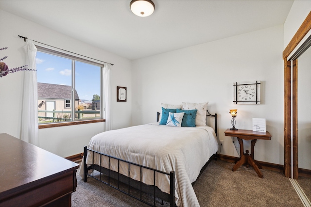4416 Gem Ranch Rd, Stevensville, MT 59870 - bedroom featuring dark colored carpet and baseboards