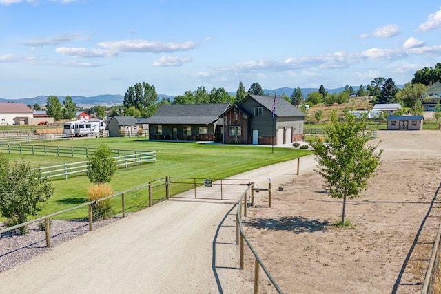 4416 Gem Ranch Rd, Stevensville, MT 59870 - view of home's community with a gate, a mountain view, and a view of countryside