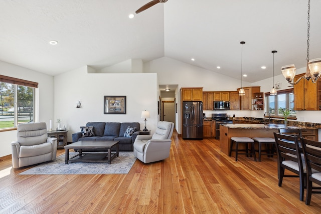 4416 Gem Ranch Rd, Stevensville, MT 59870 - living room featuring light wood-type flooring, plenty of natural light, a chandelier, recessed lighting, and a ceiling fan