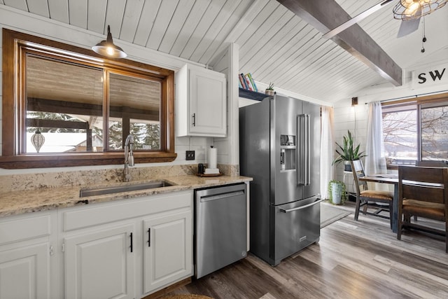 65637 Mt Highway 37, Eureka, MT 59917 - kitchen featuring stainless steel appliances, wooden ceiling, white cabinetry, dark wood finished floors, and light stone countertops