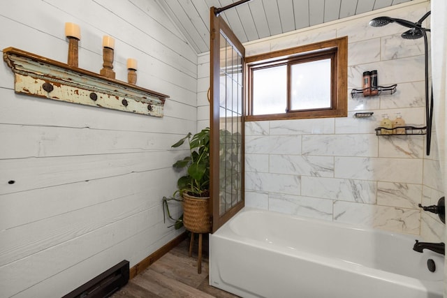 65637 Mt Highway 37, Eureka, MT 59917 - bathroom featuring wood finished floors, tub / shower combination, and wooden walls