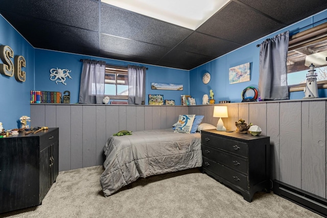 65637 Mt Highway 37, Eureka, MT 59917 - bedroom featuring carpet flooring, a paneled ceiling, a wainscoted wall, and wooden walls
