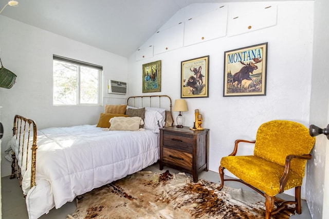 65637 Mt Highway 37, Eureka, MT 59917 - bedroom featuring lofted ceiling, a wall mounted air conditioner, and concrete flooring