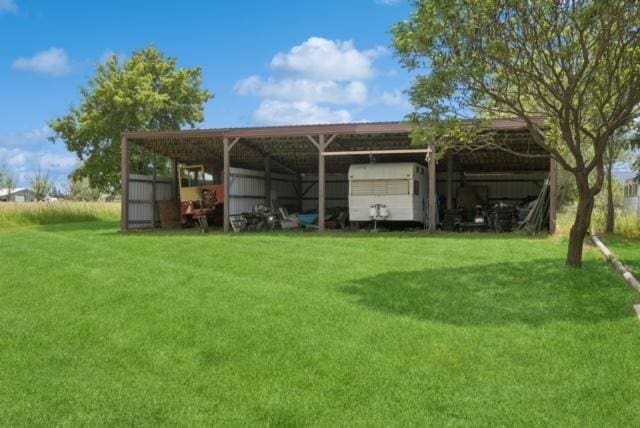 65637 Mt Highway 37, Eureka, MT 59917 - view of parking / parking lot with an outbuilding and a detached carport