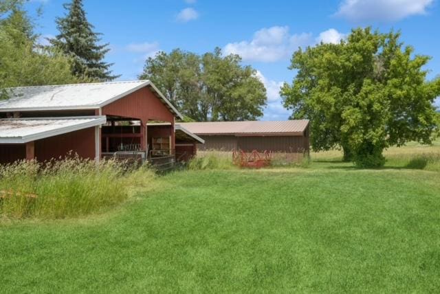 65637 Mt Highway 37, Eureka, MT 59917 - rear view of house with a lawn