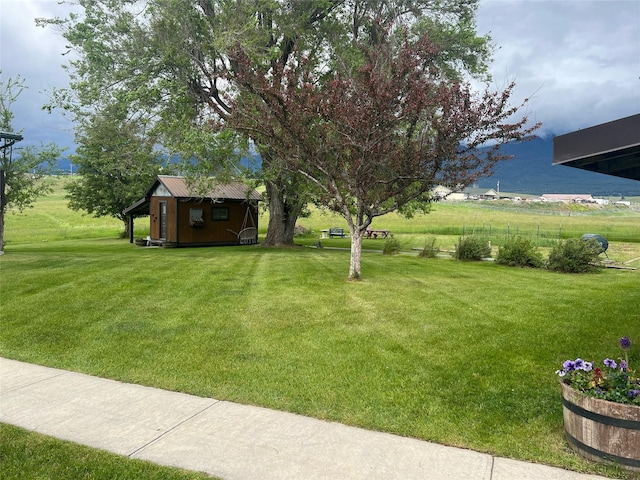 65637 Mt Highway 37, Eureka, MT 59917 - view of grassy yard featuring an outdoor structure