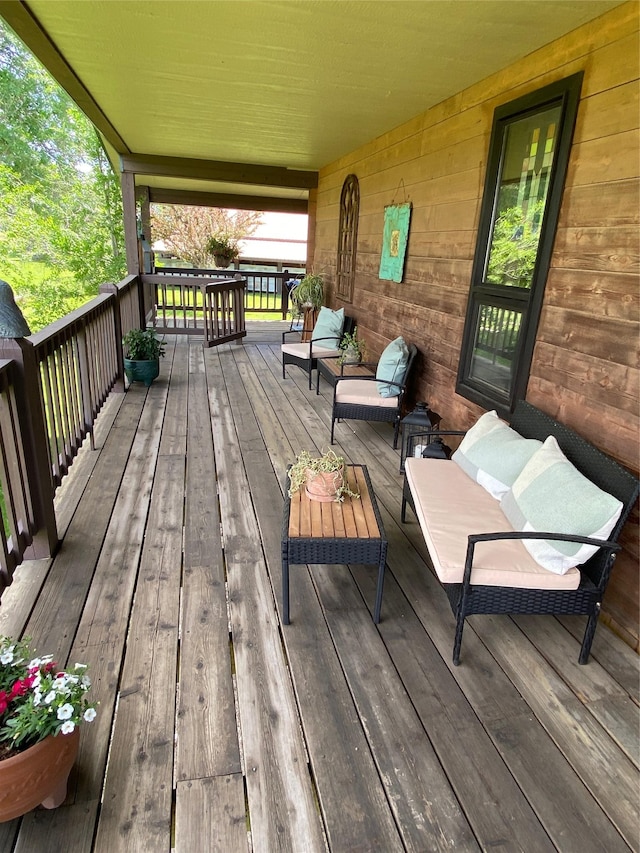65637 Mt Highway 37, Eureka, MT 59917 - wooden terrace featuring an outdoor hangout area