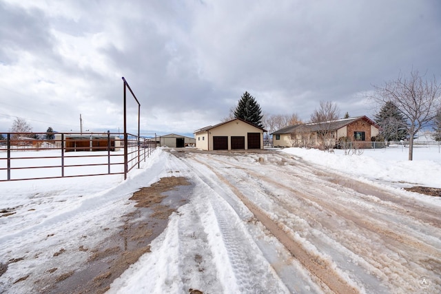 view of front of property with an outbuilding and a detached garage