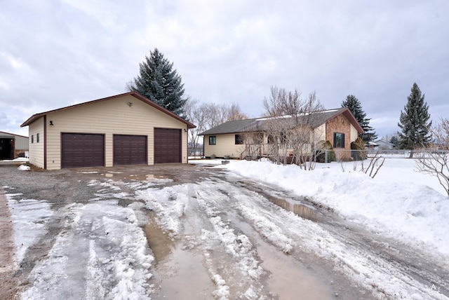 view of front of house with an outbuilding and a detached garage