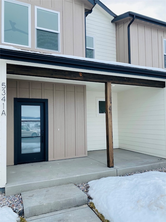 entrance to property featuring board and batten siding