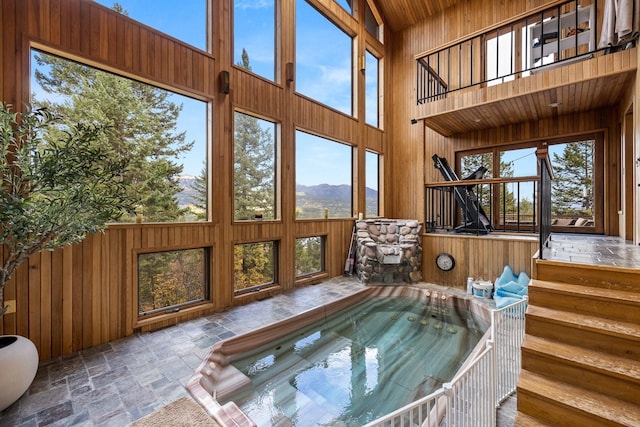 sunroom / solarium with a jacuzzi and a wealth of natural light