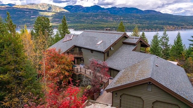 bird's eye view with a water and mountain view