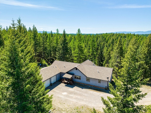 drone / aerial view with a view of trees