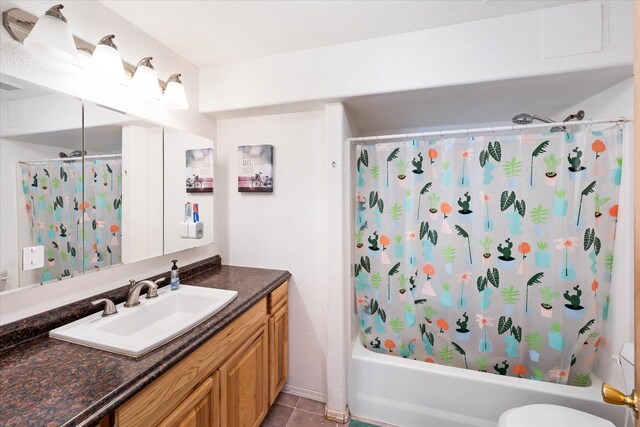 full bath featuring visible vents, toilet, shower / tub combo, vanity, and tile patterned floors