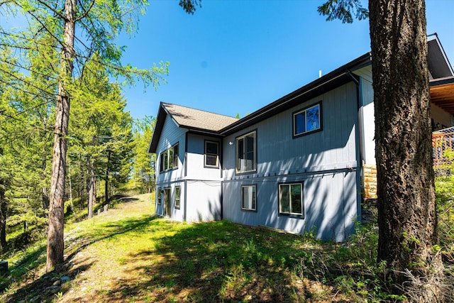 view of property exterior with a yard