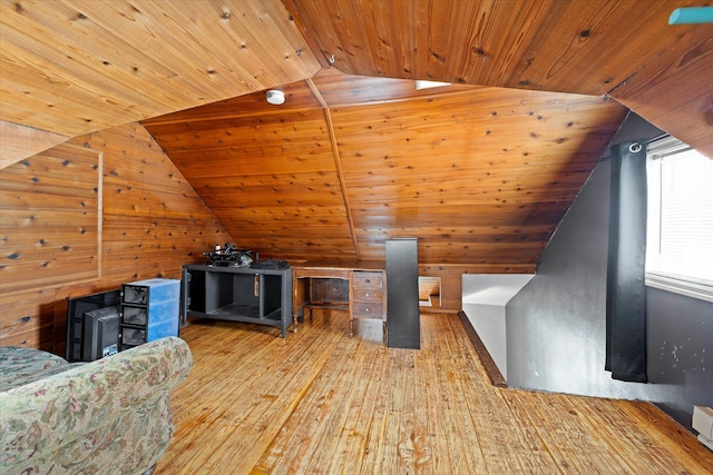 additional living space with lofted ceiling, wooden ceiling, and hardwood / wood-style flooring