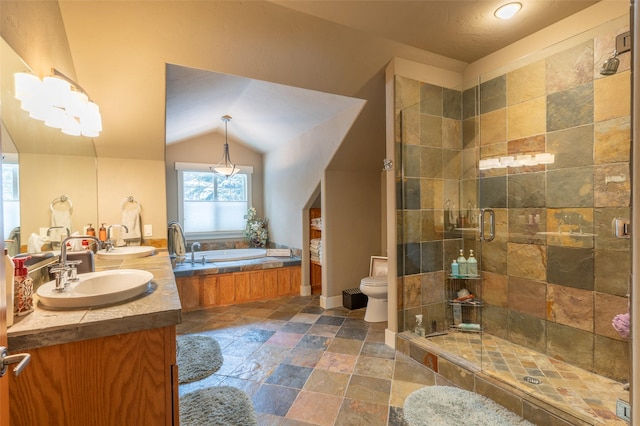 935 Pack Rat Ln, Whitefish, MT 59937 - bathroom with double vanity, a garden tub, stone tile floors, toilet, and a stall shower