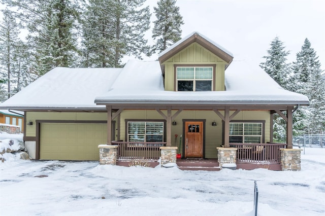 935 Pack Rat Ln, Whitefish, MT 59937 - view of front of property with a porch, an attached garage, and board and batten siding