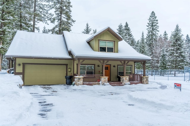 935 Pack Rat Ln, Whitefish, MT 59937 - view of front of property featuring a garage and a porch