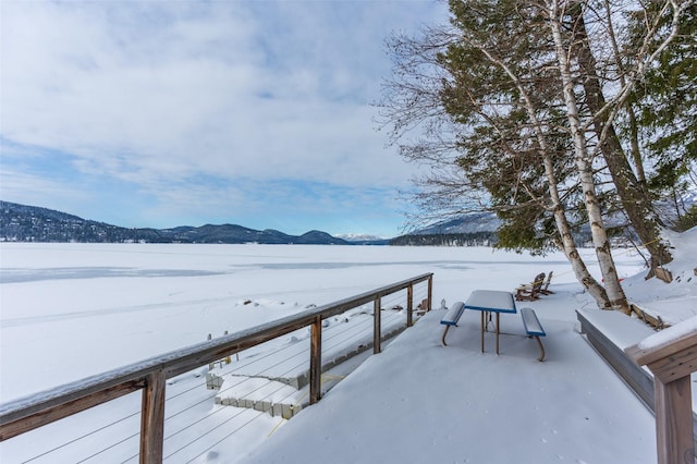 935 Pack Rat Ln, Whitefish, MT 59937 - snow covered deck featuring a mountain view
