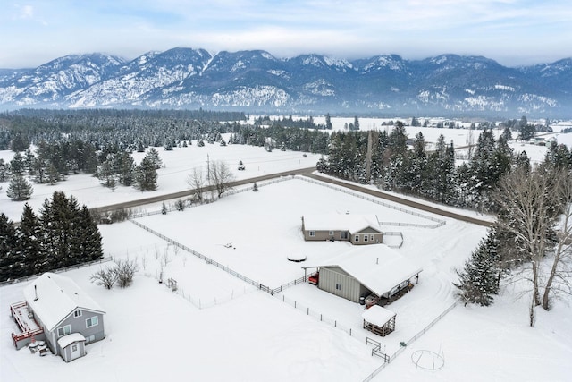 snowy aerial view featuring a mountain view