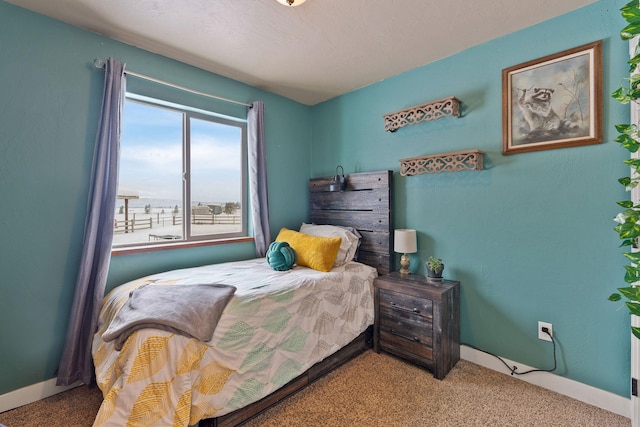 carpeted bedroom with baseboards