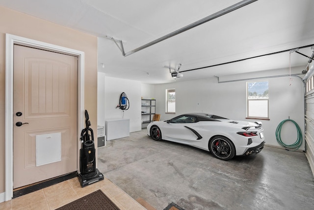 garage with refrigerator and a garage door opener