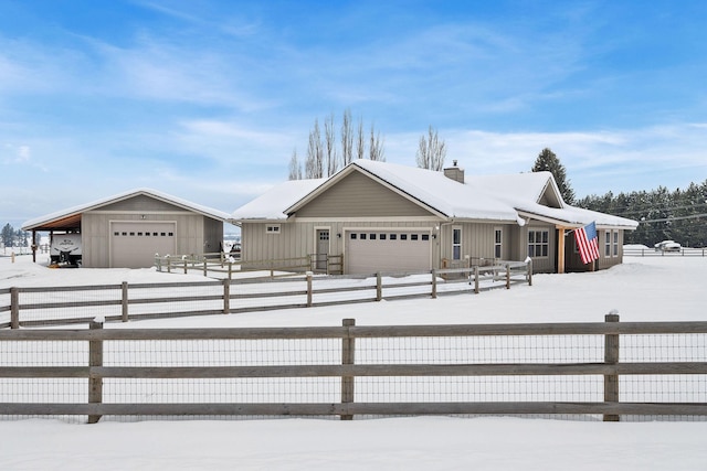 view of front of house featuring a fenced front yard, a chimney, and board and batten siding