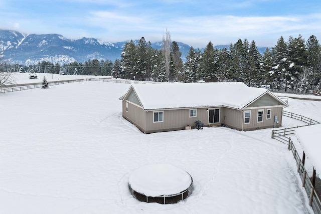 snowy aerial view featuring a mountain view