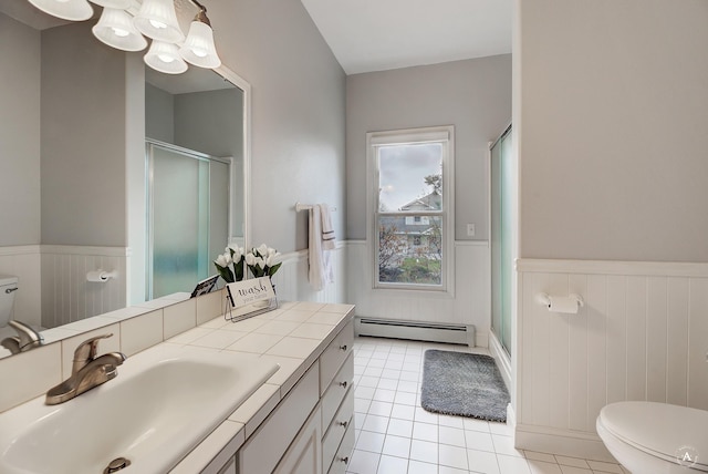 full bathroom with a stall shower, a baseboard radiator, wainscoting, and toilet