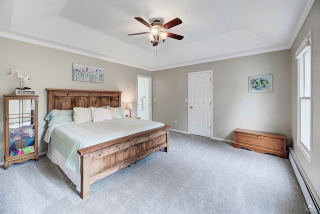 bedroom featuring a baseboard heating unit, carpet floors, baseboards, a raised ceiling, and crown molding