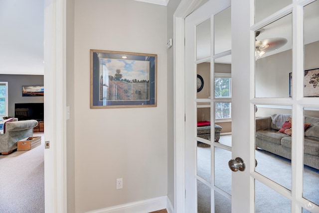 details with carpet floors, baseboards, a ceiling fan, and french doors