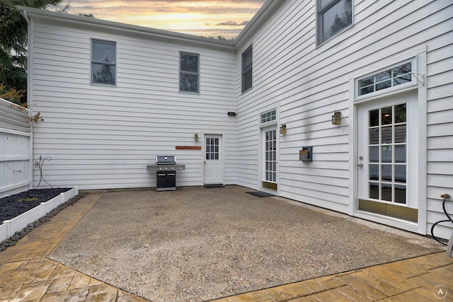 exterior space featuring a garden and area for grilling