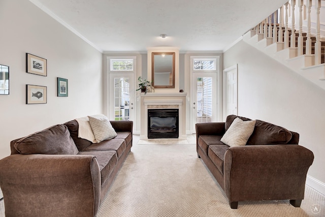 living area featuring stairs, ornamental molding, a wealth of natural light, and light colored carpet