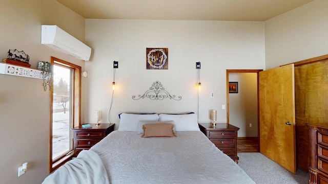 carpeted bedroom featuring a wall unit AC