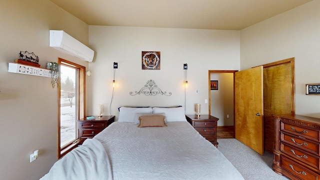 carpeted bedroom with an AC wall unit