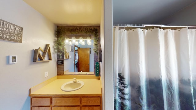 bathroom with a shower with curtain and vanity