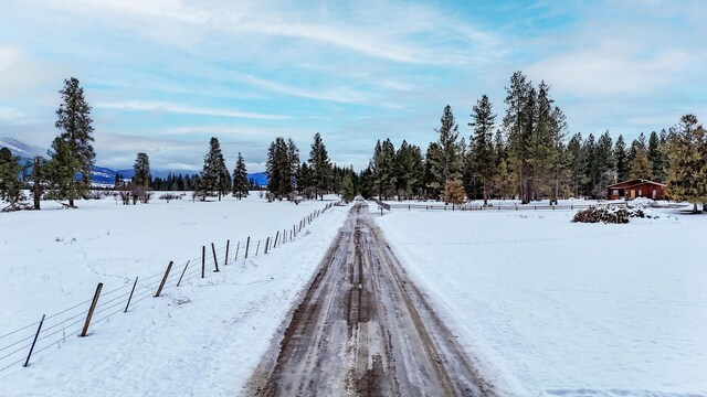 view of yard layered in snow