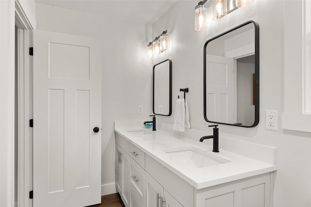 bathroom featuring double vanity and a sink