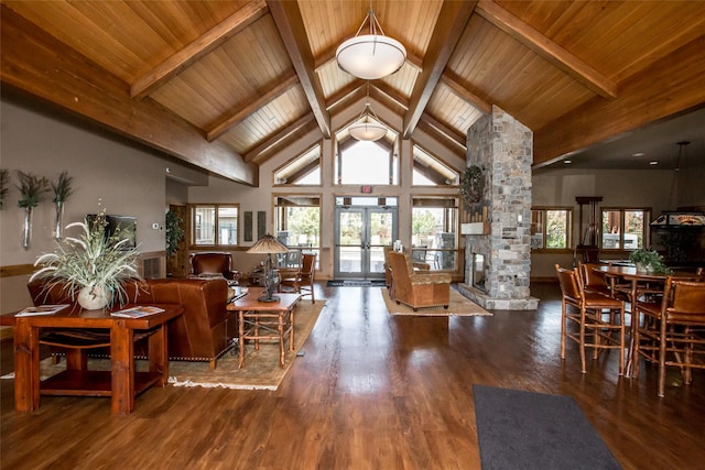 living area featuring a healthy amount of sunlight, wood finished floors, and french doors