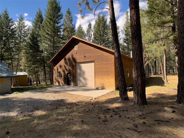 detached garage with concrete driveway